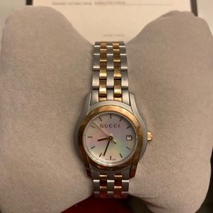 Gucci women watch. Silver and gold, diamonds.